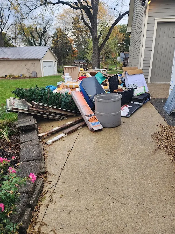 Dumpster being loaded with debris for Residential Dumpster Rental in Olga